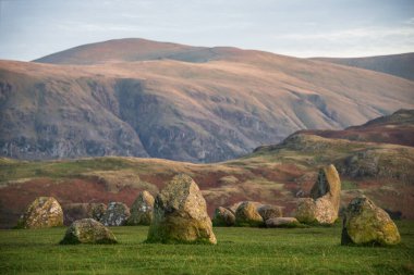 Beautiful detail landscape image of Castlerigg Stone Circle in Lake District during Autumn sunset clipart