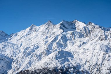 Famous mountain massif with Allalinhorn and Dom near Saas-Fee in Switzerland clipart