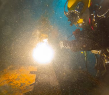 Underwater oxy-fuel in deep ocean depths closeup clipart