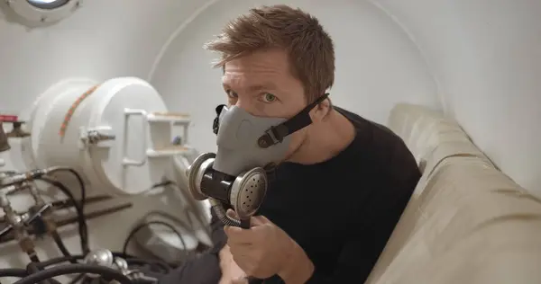 stock image Military man receiving treatment in industrial hyperbaric chamber closeup