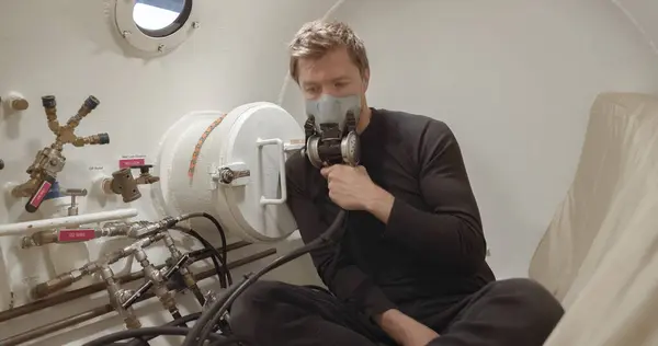 stock image Military man receiving treatment in industrial hyperbaric chamber closeup