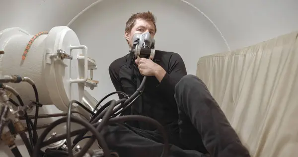 Stock image Military man receiving treatment in industrial hyperbaric chamber closeup