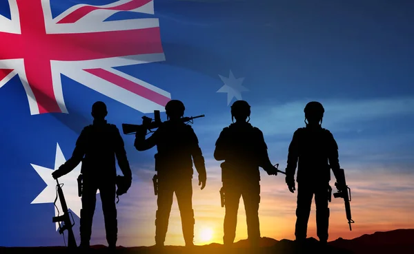 stock vector Silhouette of Soldiers with Australian flag on background of sunset. Concept - Armed Force. EPS10 vector