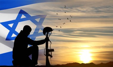 Silhouette of soldier kneeling down on a background of sunset and Israel flag. Greetning card for National Holidyas. EPS10 vector