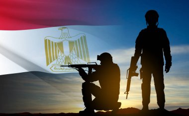 Silhouettes of soldiers against the sunset with Egypt flag. Background for National Holidays. Concept - Armed Forces. EPS10 vector