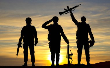 Silhouettes of soldiers against the sunset. Armed forces concept. EPS10 vector