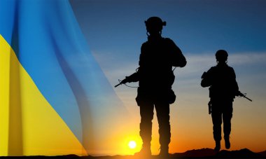 Flag of Ukraine with silhouettes of soldiers against the sunset. Armed forces of Ukraine concept. EPS10 vector