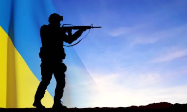 Flag of Ukraine with silhouettes of soldiers against the sunset. Armed forces of Ukraine concept. EPS10 vector