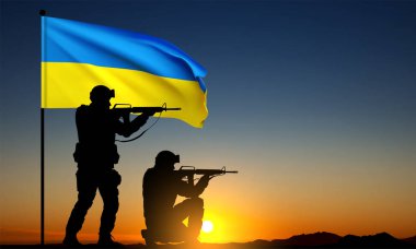 Silhouettes of soldiers with Ukraine flag against the sunset. Armed forces of Ukraine concept. EPS10 vector