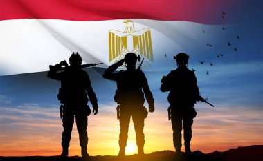 Silhouettes of soldiers against the sunset with Egypt flag. Background for National Holidays. Concept - Armed Forces. EPS10 vector