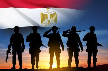 Silhouettes of soldiers against the sunset with Egypt flag. Background for National Holidays. Concept - Armed Forces. EPS10 vector