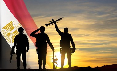 Silhouettes of soldiers against the sunset with Egypt flag. Background for National Holidays. Concept - Armed Forces. EPS10 vector