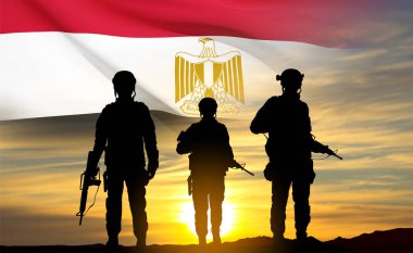 Silhouettes of soldiers against the sunset with Egypt flag. Background for National Holidays. Concept - Armed Forces. EPS10 vector