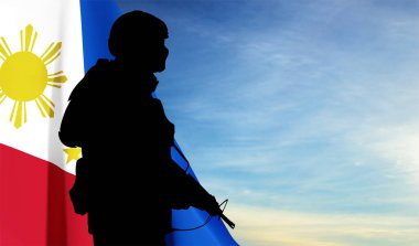 Silhouette of a soldier with Philippines flag on background of sky. Concept - Independence day. EPS10 vector clipart