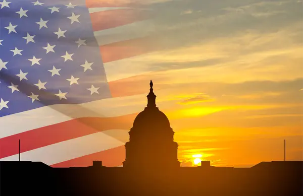 stock image United States Capitol building silhouette and US flags at sunset