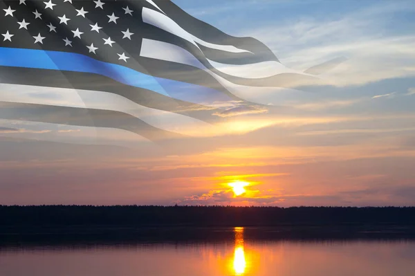 Thin Blue Line. American flag with police blue line on a background of sunset. Support of police and law enforcement. National Law Enforcement Appreciation Day.