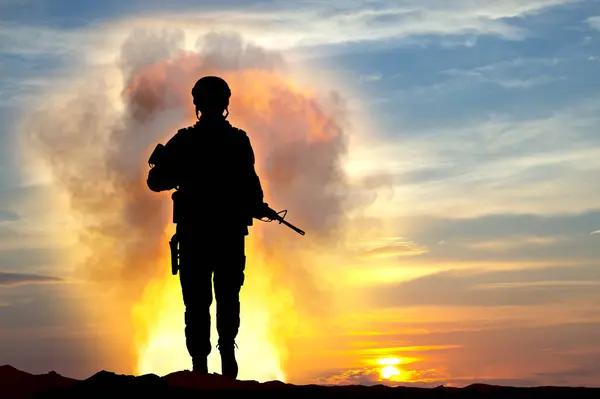 Explosion of a bomb and silhouette of soldier against the sunset. 3d-rendering