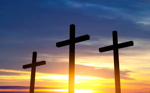 Crucifixion Of Jesus Christ at sunrise. Three crosses on hill. Good Friday concept