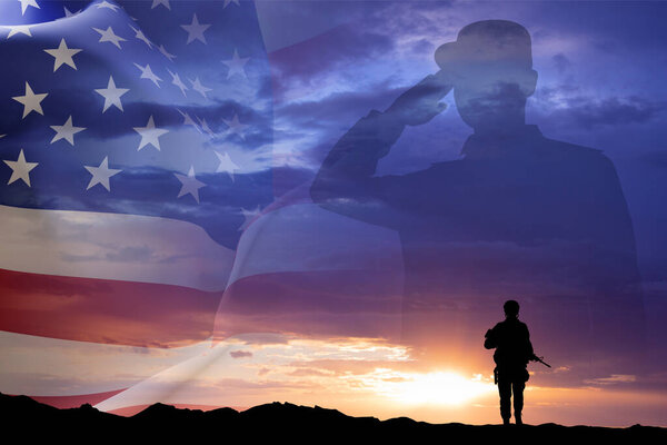 Силуэты солдат с флагом США на закате. День ветеранов, концепция Дня памяти