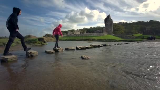People Using Old Stepping Stones Cross Ewenny River Ogmore Castle — Stock Video