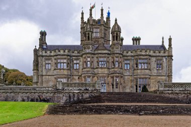 Gothic style Victorian mansion house. Tudor Gothic Mansion elevation detail of stonework - Margam castle. Margam Country Park, Margam, Port Talbot, South Wales, United Kingdom - 15th of October 2022 clipart