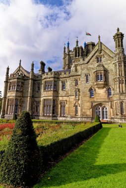 Gothic style Victorian mansion house. Tudor Gothic Mansion elevation detail of stonework - Margam castle. Margam Country Park, Margam, Port Talbot, South Wales, United Kingdom - 15th of October 2022 clipart