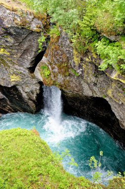River Briksdalselva and the Kleivafossen Waterfall. Jostedalsbreen National Park - Waterfall - Europe travel destination Norway