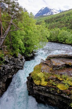 River Briksdalselva and the Kleivafossen Waterfall. Jostedalsbreen National Park - Waterfall - Europe travel destination Norway