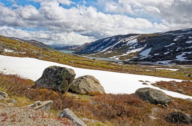 Norsk Fjordsenter Geiranger - Landscape of Geiranger Norway. Summertime landscape with mountains and snow. 02.07.2012
