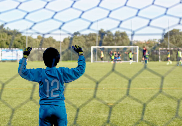 Young goalkeeper kid teenage boy playing football soccer game sports in Alcanena Municipality, Portugal. Municipal Stadium Joaquim Maria Baptista - 29th of September 2014