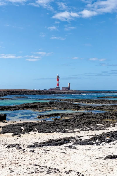 Natural tidal pools of The Playa de los Charcos beach and The Toston Lighthouse - Natural Pools of Los Laguitos Beach or Los Charcos on Fuerteventura, Canary islands, Spain. 24.09.2023