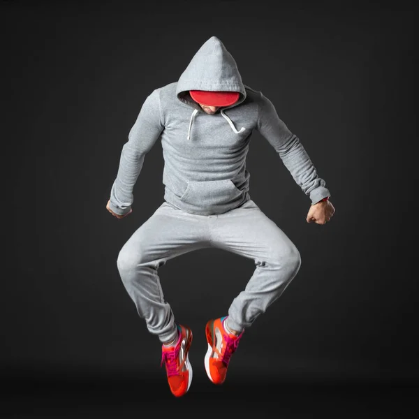 Young Male Dancer Jumping Isolated Dark Gray Background — Stockfoto
