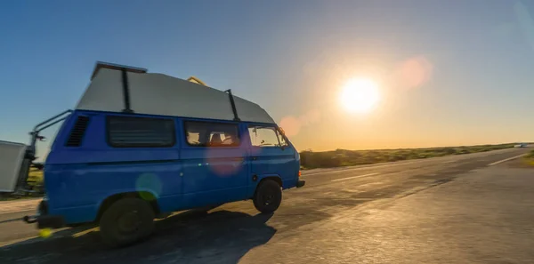 Transporter Camping Van bus at the California Ocean in the coastal Nature