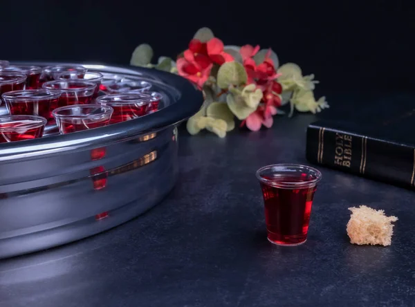 Taking communion concept - the wine and the bread symbols of Jesus Christ blood and body with Holy Bible. Easter Passover and Lord Supper concept.