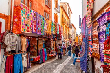 Granada, Spain - February 26, 2022: Traditional and touristic goods sold at the muslim quarter of the historical city of Granada, Andalusia, Spain. clipart