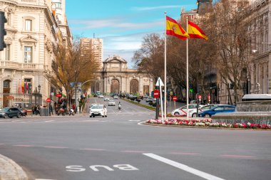Madrid, Spain-Feb 19, 2022: The Puerta de Alcala is a Neo-classical gate in the Plaza de la Independencia in Madrid, Spain. clipart