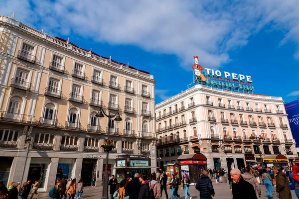 Stock image Madrid, Spain - FEB 19, 2022: The Puerta del Sol is a public square in Madrid, one of the best known and busiest places in the city. The centre of the radial network of Spanish roads.