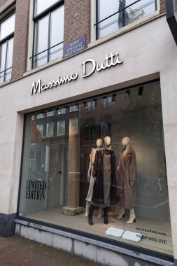 Amsterdam, the Netherlands - October 12, 2021: Store front of Massio Dutti, a brand of the Spanish Inditex Group, Amsterdam branch. clipart