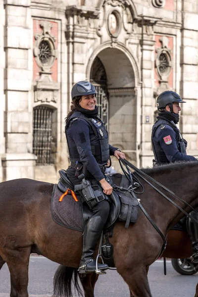 stock image Madrid, Spain - FEB 16, 2022: Spanish mounted police forces patrolling through the touristic spots in Madrid, Spain.