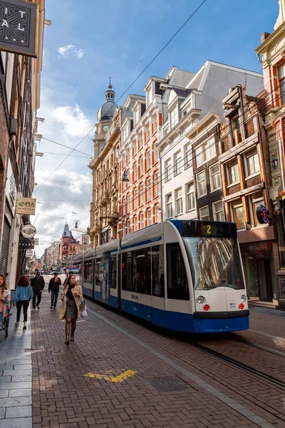 stock image Amsterdam, NL - OCT 11, 2021: Light rail electric tram carrying passengers in Amsterdam, the Netherlands.