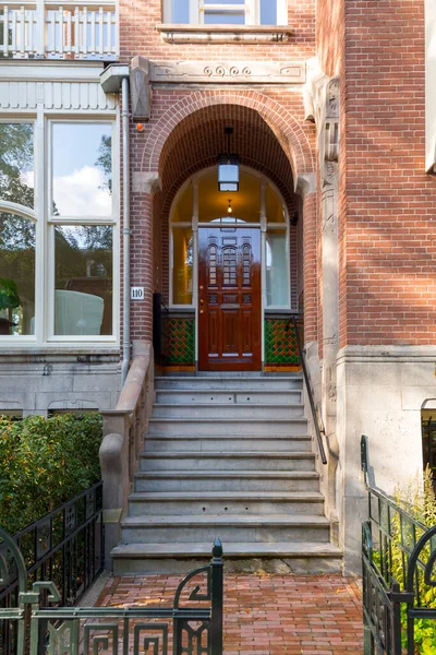 stock image Amsterdam, NL - OCT 11, 2021: Typical dutch architectural detail, a door in Amsterdam, the Netherlands.