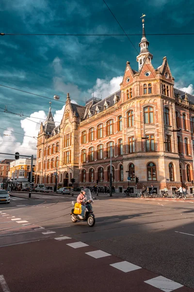 stock image Amsterdam, the Netherlands - October 11, 2021: Street view and generic architecture in Amsterdam with typical Dutch style buildings. Amsterdam is one of Europe's most visited tourist destinations.