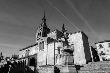 Segovia, Spain - February 18, 2022: Plaza Medina del Campo, a historic square that hosts San Martin Church, Las Sirenas de Segovia and Juan Bravo statues. clipart