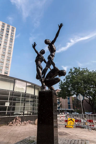 stock image Rotterdam, Netherlands - October 10, 2021: Bronze public sculpture titled Triomf by Kees Verkade, located on Keizerstraat, Rotterdam, NL.