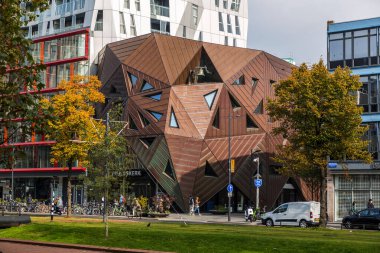 Rotterdam, NL - October 10, 2021: Pauluskerk is a futuristic church building, designed by the English architect Will Alsop on Mauritsweg in the center of Rotterdam. clipart