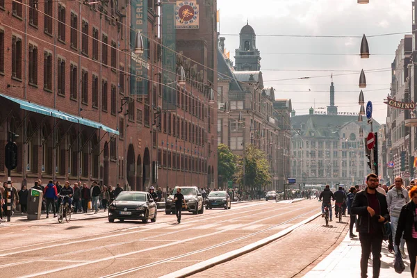 stock image Amsterdam, Netherlands - October 10, 2021: The Damrak is an avenue and partially filled in canal at the centre of Amsterdam, running between Amsterdam Centraal and Dam Square.