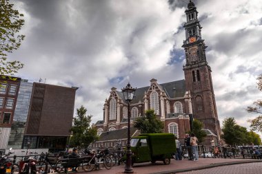 Amsterdam, NL - October 10, 2021: The Westerkerk, Western Church is a Reformed church within Dutch Protestant Calvinism in central Amsterdam, Netherlands. clipart
