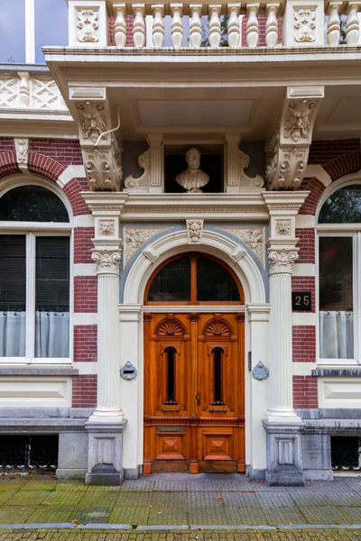 stock image Amsterdam, NL - OCT 10, 2021: Typical dutch architectural detail, a door in Amsterdam, the Netherlands.