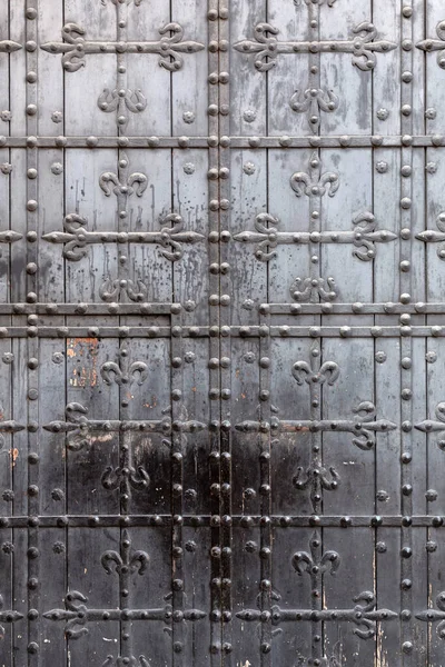 stock image Detail form an ancient church door with rusty floral decorations