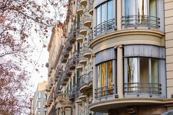 stock image Barcelona, Spain - February 10, 2022: Buildings around the Passeig de Gracia, one of the main avenues in Eixample district of Barcelona, Spain.